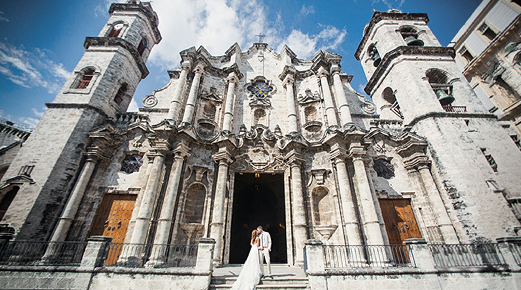 Editorial wedding portraits among the stone architecture of Havana