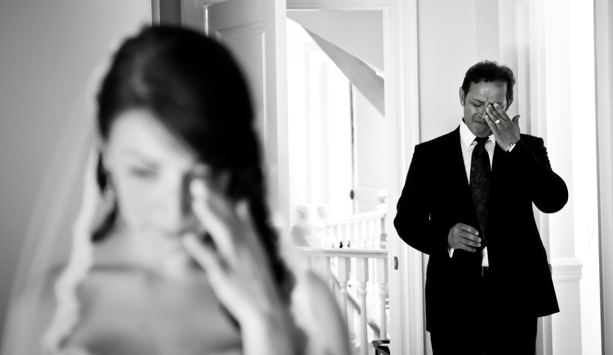 Father seeing his daughter in her wedding dress for the first time