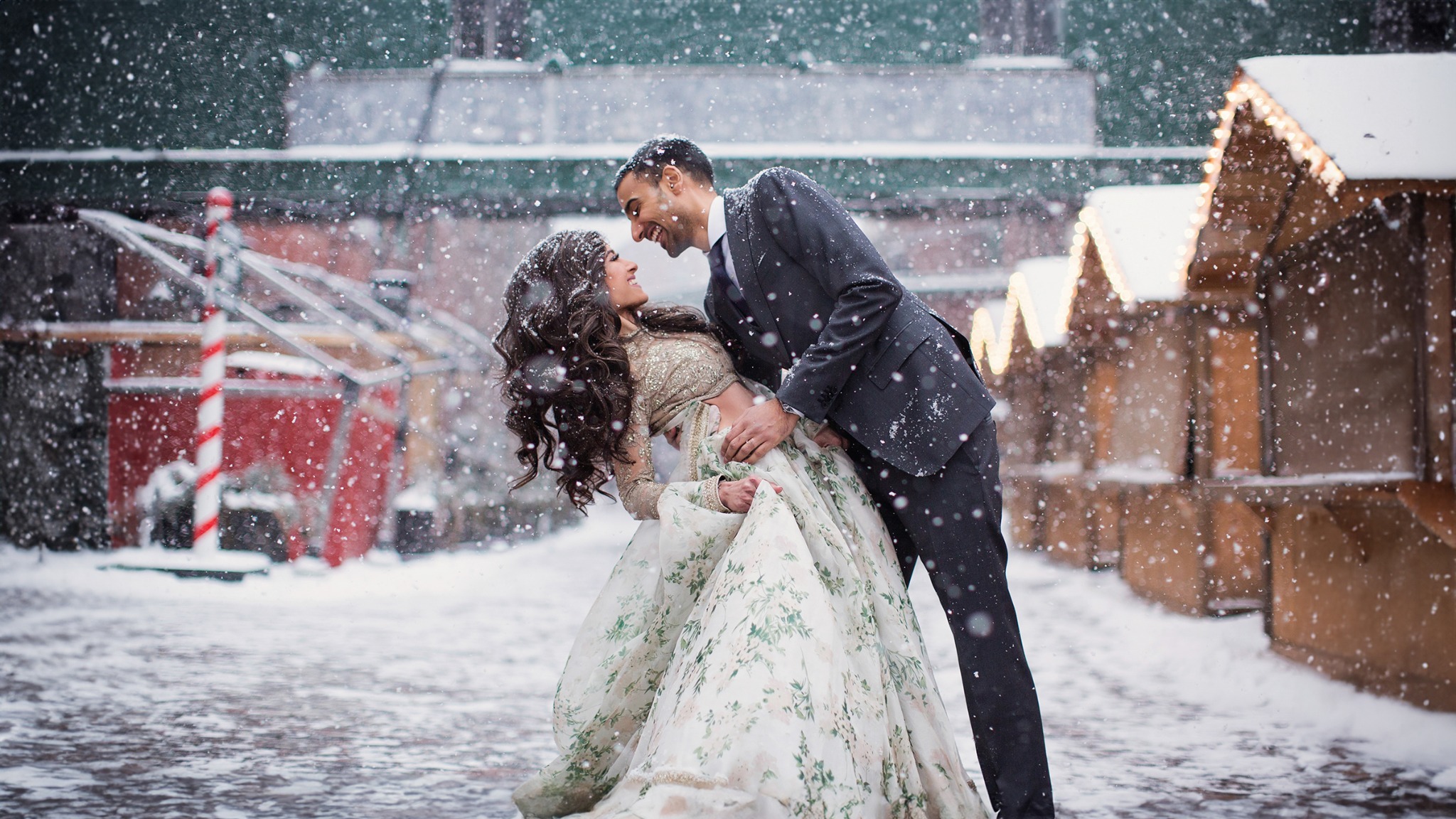 Koyelle and Akash celebrating together during a winter wedding portrait in Toronto